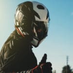 image of a motorcyclist giving the camera a thumbs up - learn how to break in a motorcycle helmet with Motohorse