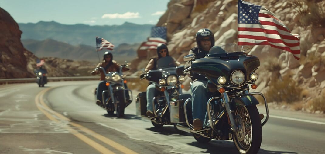 image of motorcyclists riding with the American falg - learn the motorcycle helmet laws by state with Motohorse, a motorcycle accessories & parts online shop